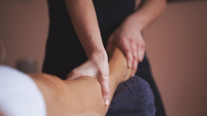 A massage therapist giving a client a massage. massage therapist