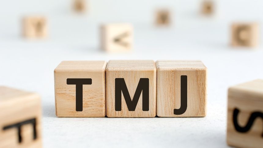 Blocks next to each other that spell out TMJ. massage for tmj pain